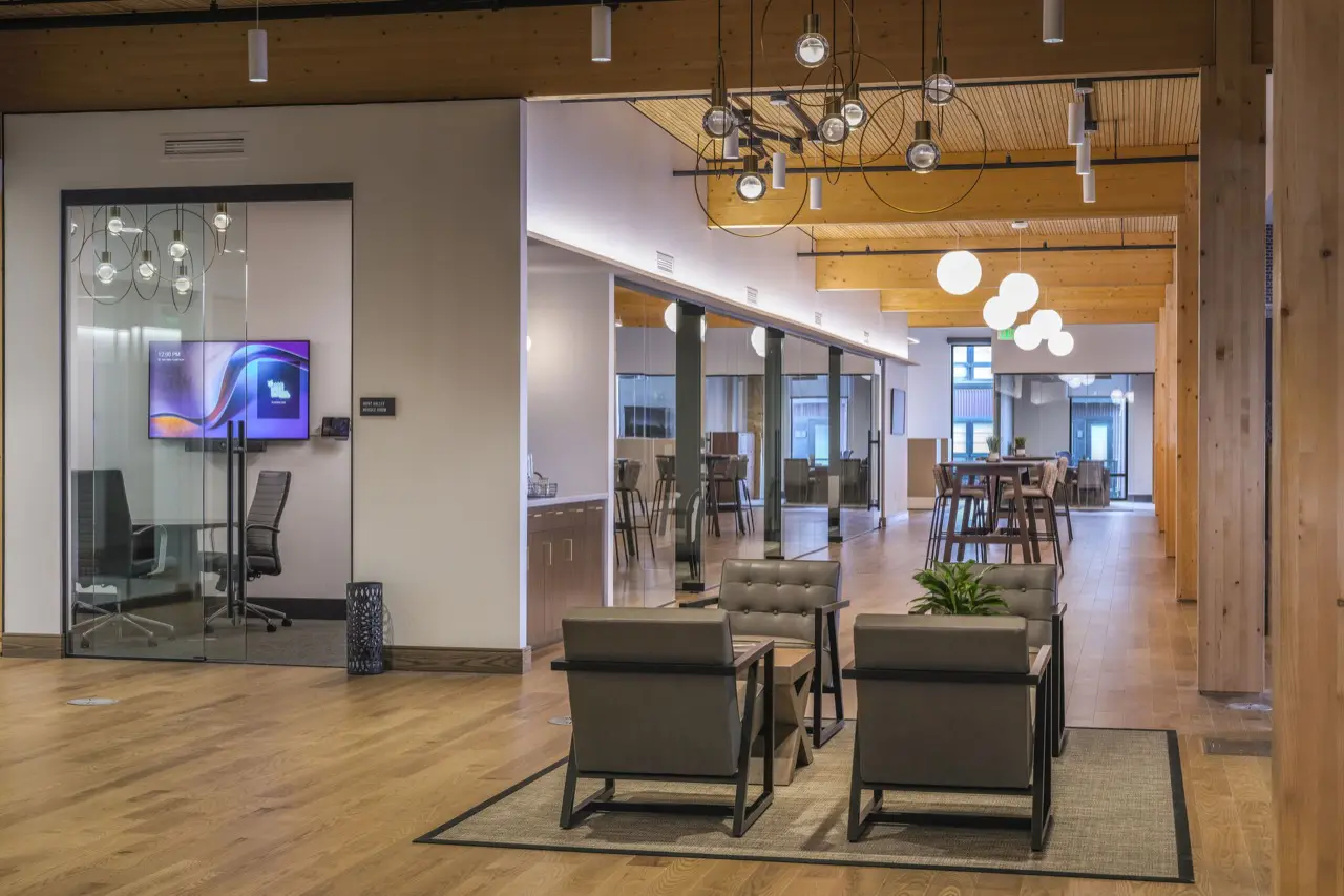 Office lobby with exposed timber ceiling and warm lighting